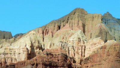 a group of mountains with a blue sky in the background