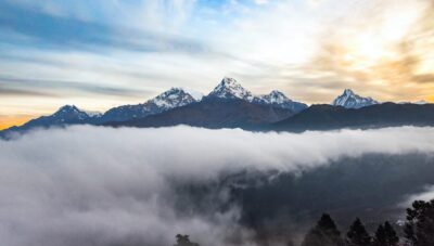 snow covered mountain under cloudy sky during daytime